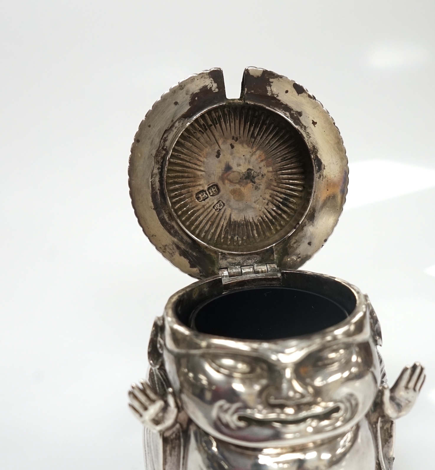 A Victorian novelty silver mustard, modelled as a Chinaman, with blue glass liner, by Richard Sibley II, London, 1847, height 85mm, 6.1oz. Condition - fair